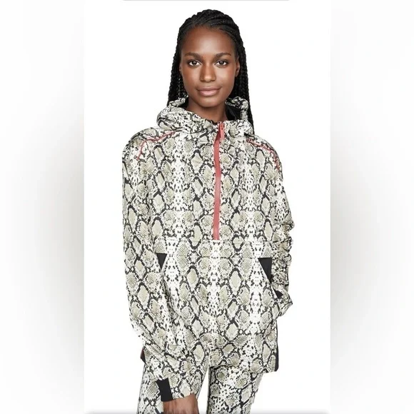 ALALA snakeskin anorak with red accents